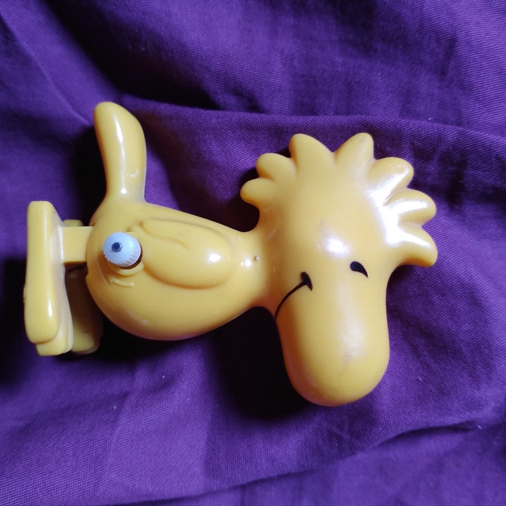 Wood stock wind up toy.